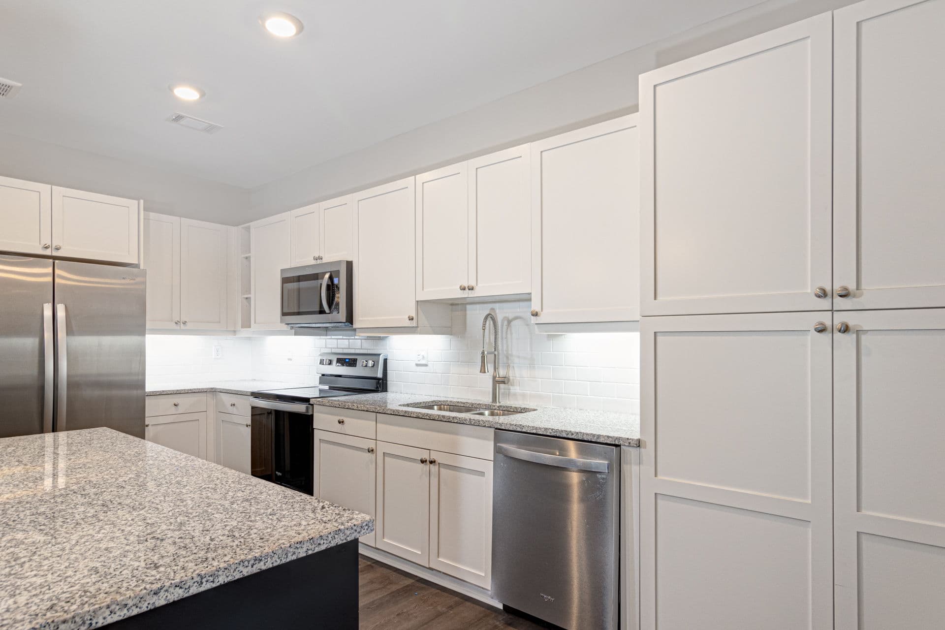 Professional kitchen design with white shaker cabinets